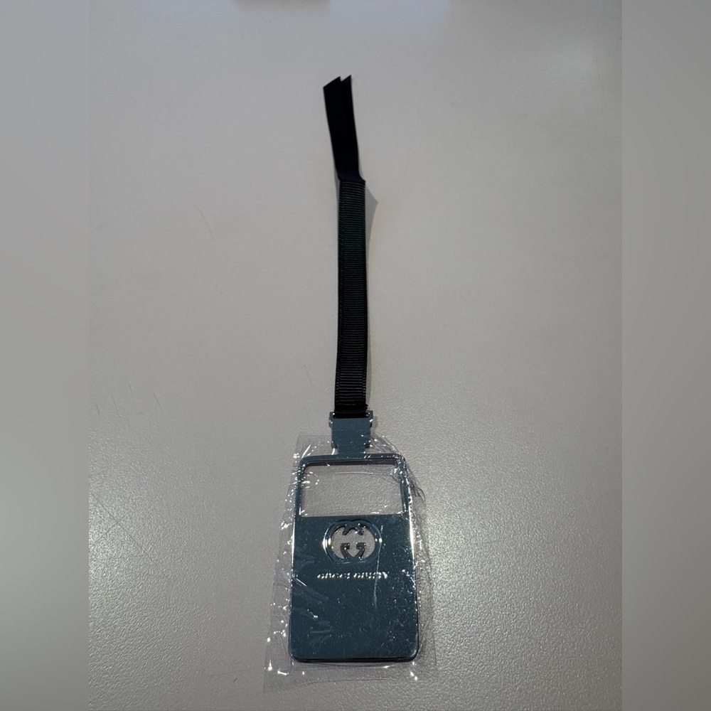 Gucci Guilty Bookmark or Nag Charm with ribbon and metal GG logo.